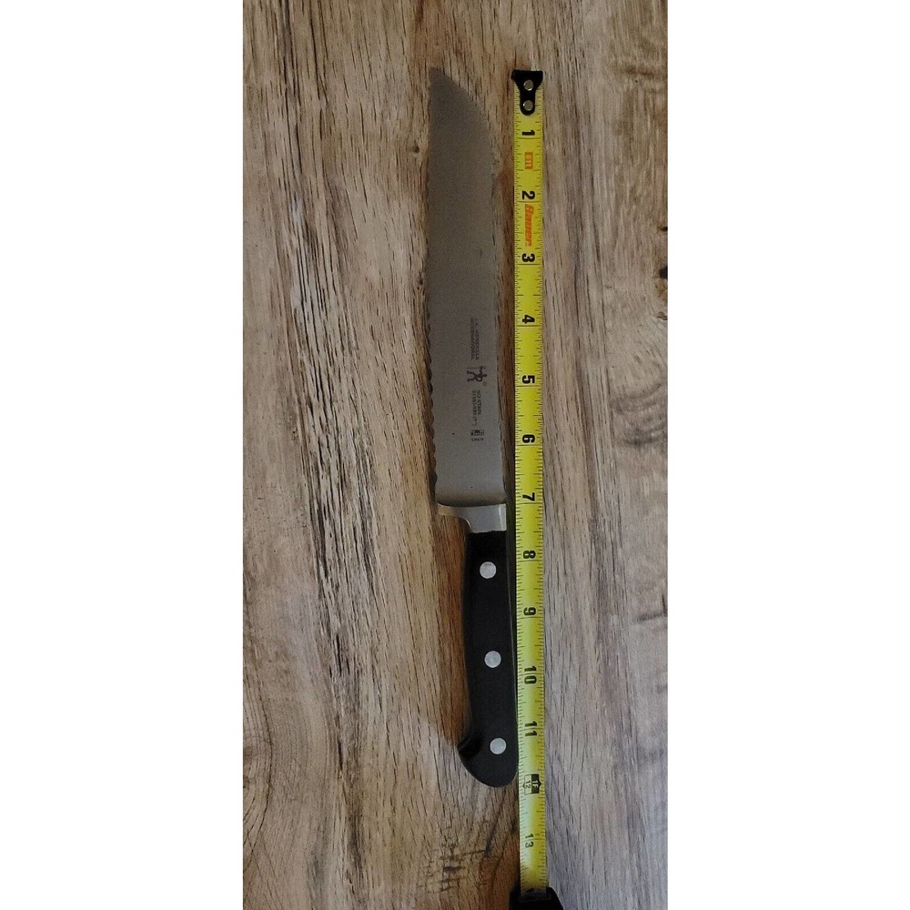 VINTAGE JA HENCKELS BREAD KNIFE 7" SERRATED BLADE 12" Total length. Spain